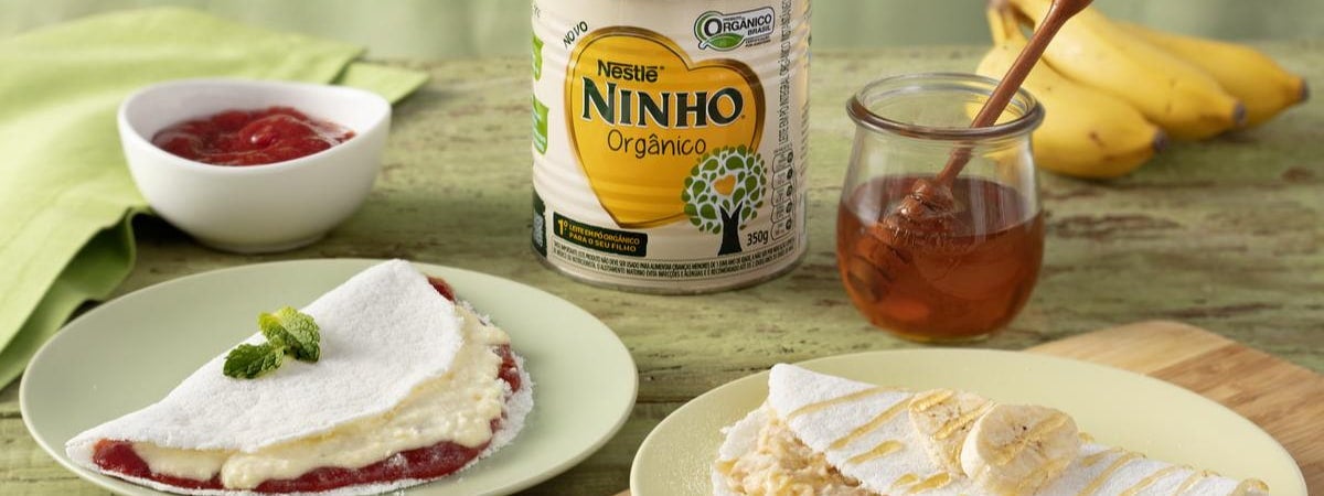 Dois pratos com tapioca, ao fundo, um pote com goiabada, uma lata de leite ninho integral, mel e bananas. Capa: Alimentos orgânicos