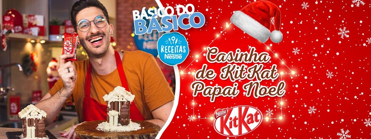 Casinha de KitKat Papai Noel Montagem de um rapaz com uma casa feita de chocolates sobre uma bancada e ao lado direito os dizeres com o título do vídeo