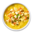Um refratário branco fundo com sopa de legumes.