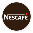 Um círculo marrom com o texto Nescafé no centro