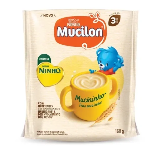 Embalagem do Mucilon Mucininho com bebida de cereal em caneca amarela e personagem azul. Indicado +3 anos.