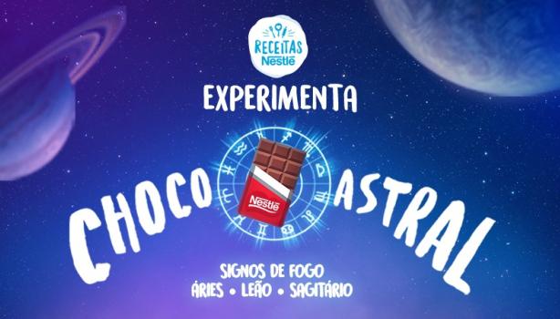 Imagem em tom roxo do céu com alguns planetas, uma barra de chocolate ao centro e um mulher com um braço levantado e dizeres