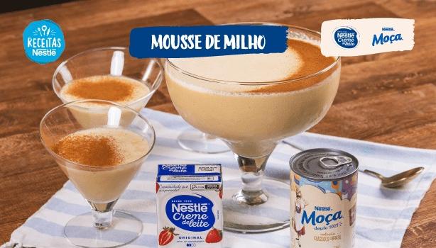 Imagem da receita de Mousse de Milho ao centro com o título centralizado no topo e os logotipos das marcas ao lado