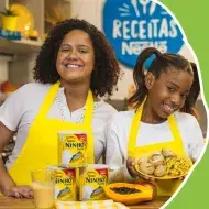Imagem com o logo de Crianças Na Cozinha escrito “Café da Manhã Nutritivo”. À esquerda, foto da Priscila e Júlia.