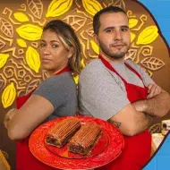 Imagem escrito Rocambole e Aloi vs Diogo seguido pelo logo Deu Ruim. À esquerda, fotos dos participantes e do rocambole.