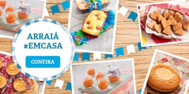 Arraiá em casa Imagem com comidas típicas de Festa Junina. À esquerda, há um banner com a mensagem "arraiá em casa".