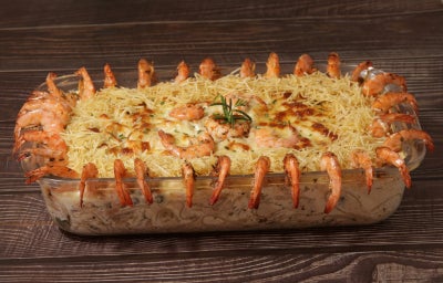 Camarão internacional cremoso e gratinado, sofisticado e ideal para ocasiões especiais.