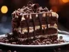 Em cima de uma mesa, prato redondo com pedaço de bolo de chocolate, recheado com creme branco, cobertura de chocolate e chocolate ao leite ralado.
