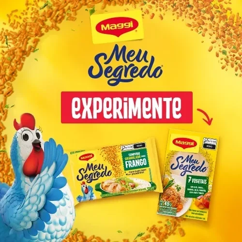 Banner Maggi Meu Segredo com mascote galinha e temperos Meu Segredo Granulado e 7 Vegetais, com chamada “Experimente”.